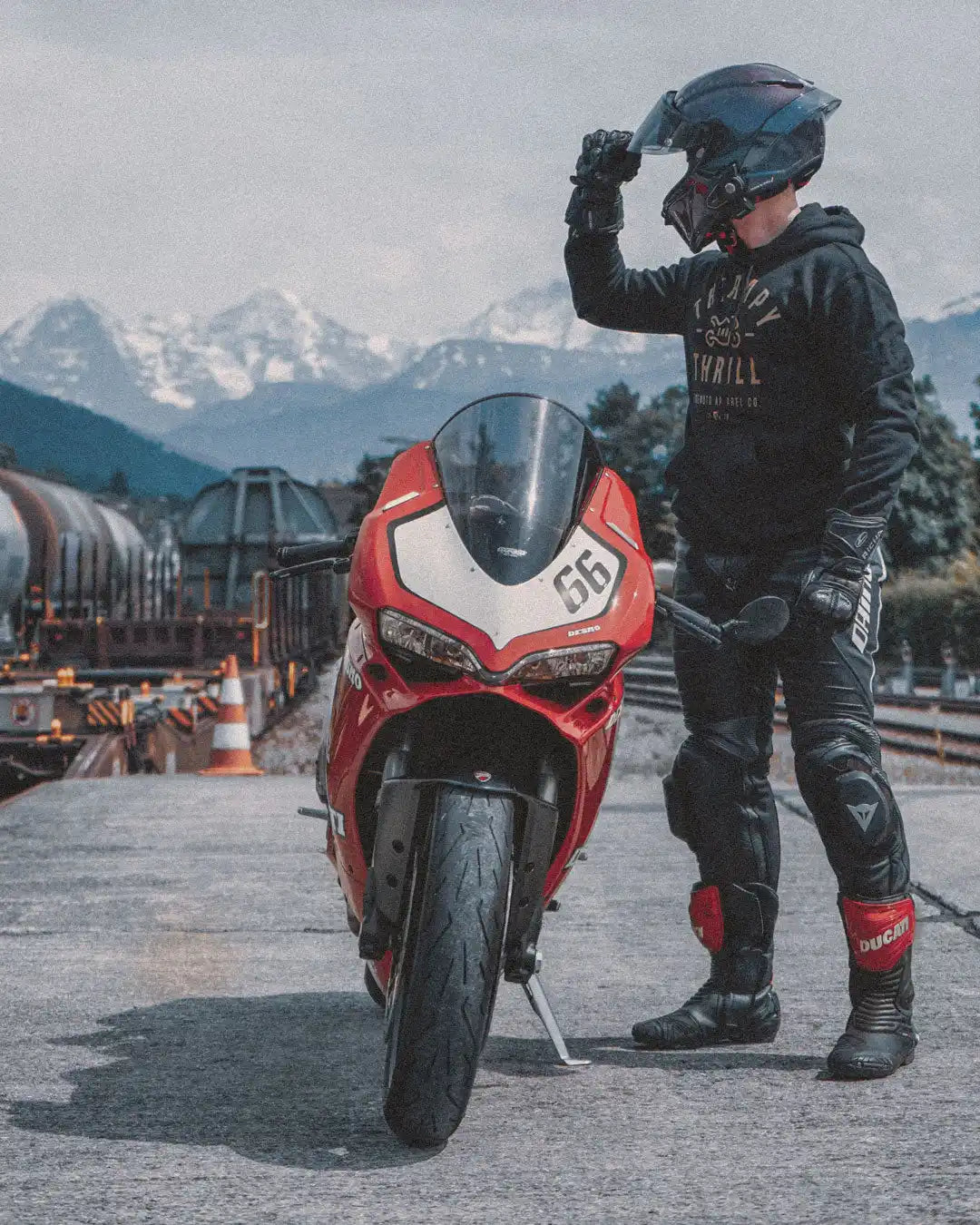 Red Ducati motorcycle with rider.